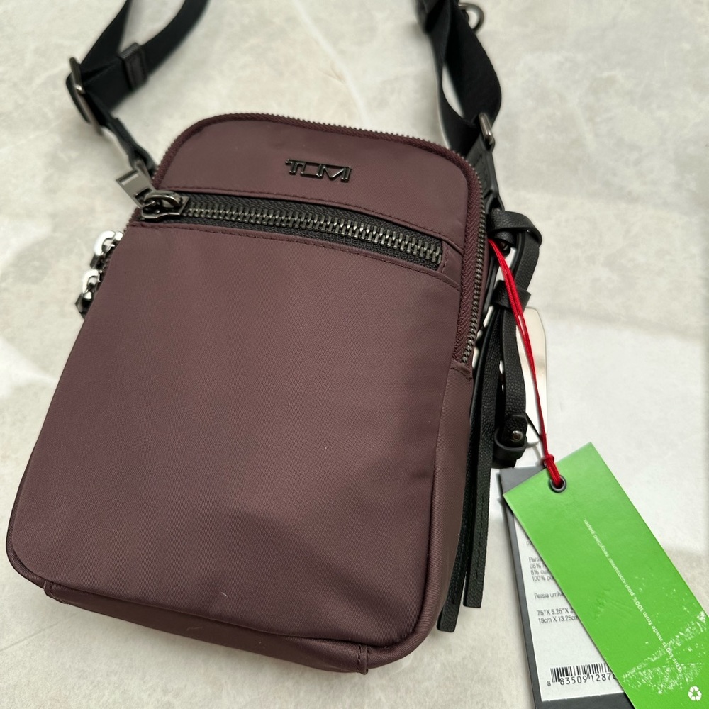 NWT Tumi crossbody dark purple Voyageur bag